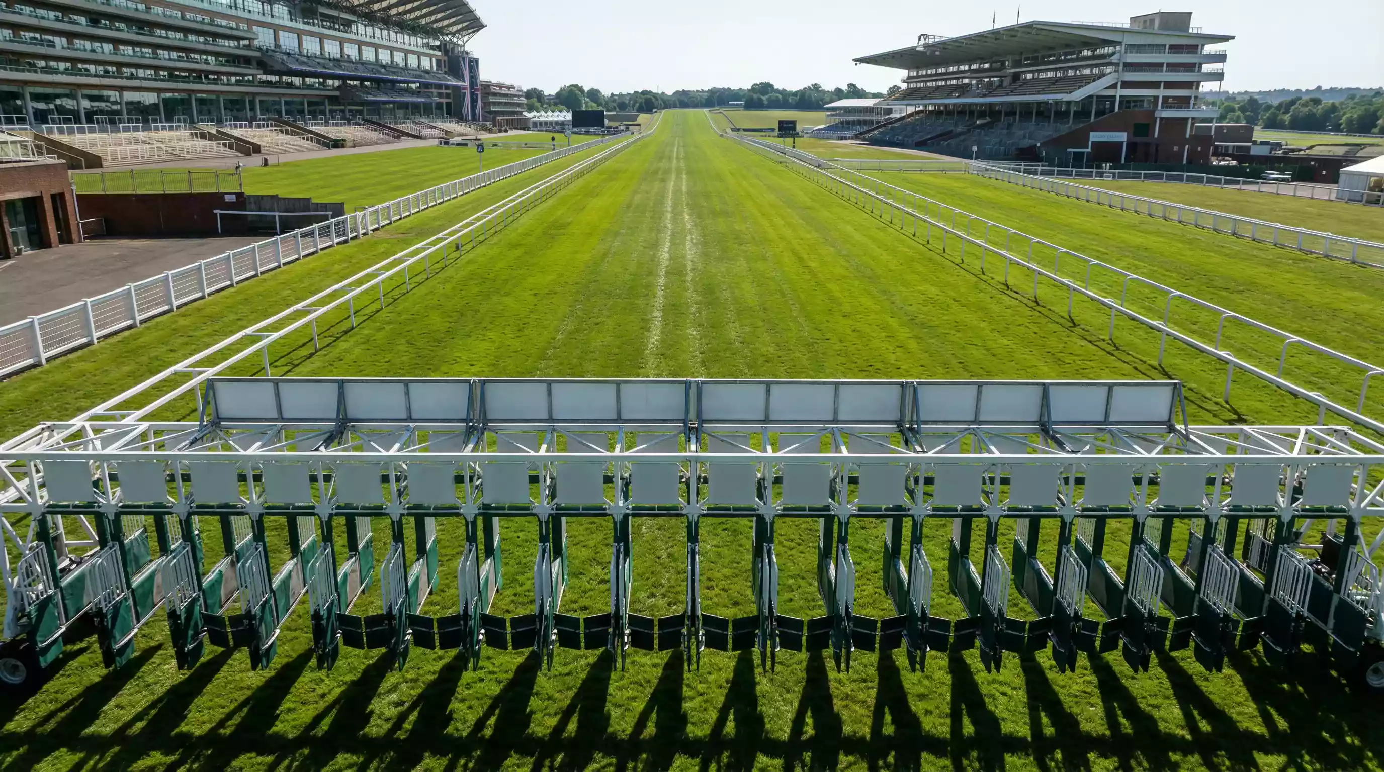 View down Ascot straight course showing high-numbered stalls toward stands side