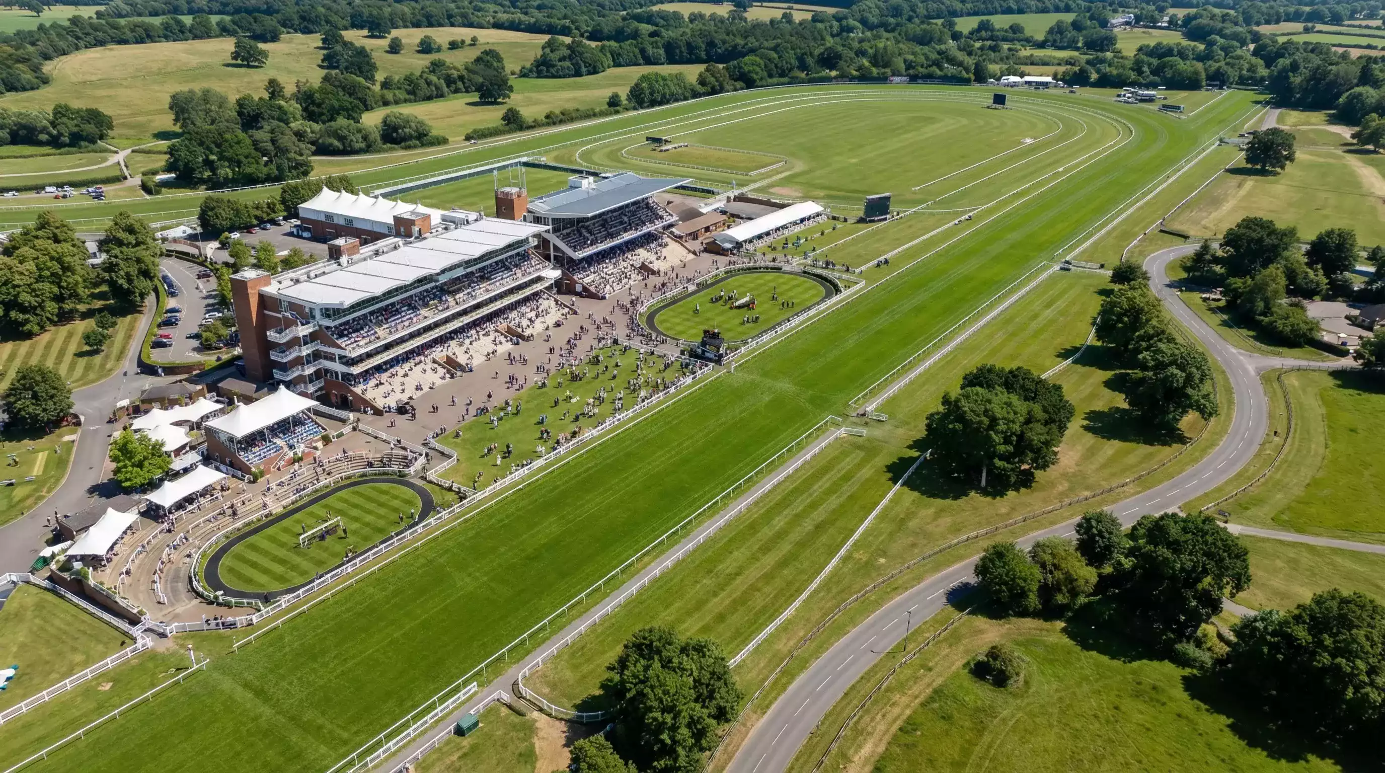Aerial view of Royal Ascot racecourse on race day with crowds in the grandstand